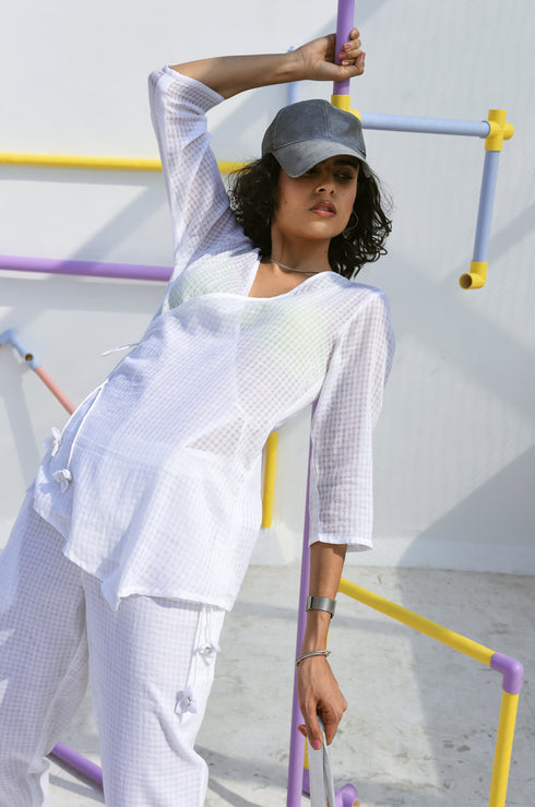 Woman wearing a white top.