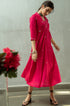 Model wearing pink fit and flare dress.