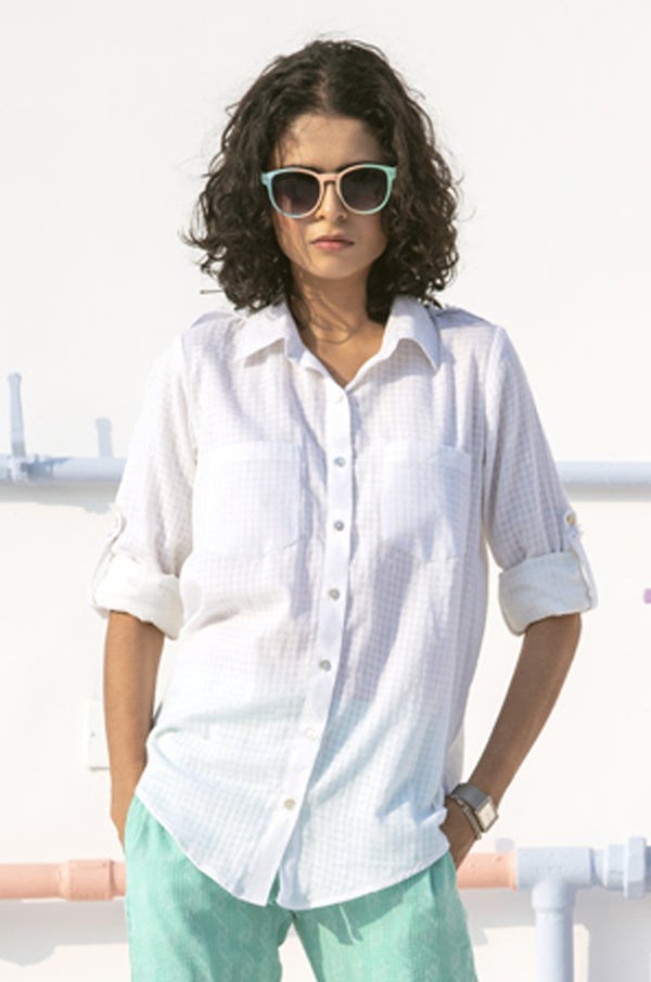 Model wearing a white shirt by Gulaal Creation.