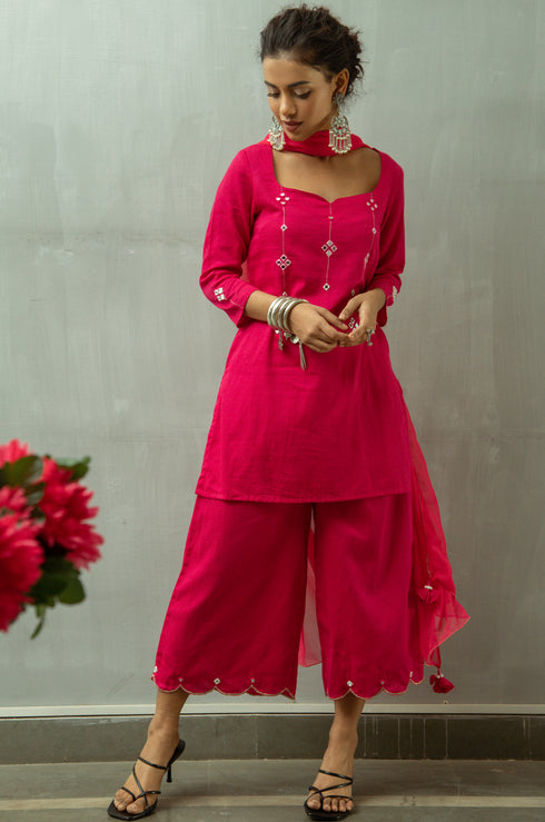 Model posing in women's pink Kurta by Gulaal.
