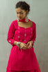 Model posing in women's pink Kurta by Gulaal.
