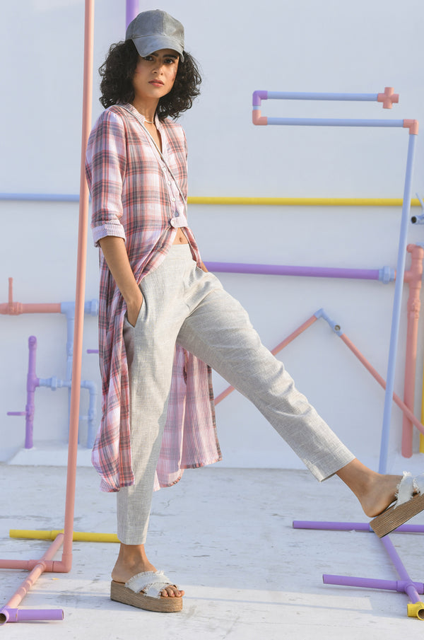 Model posing in straight-fit pants for women.