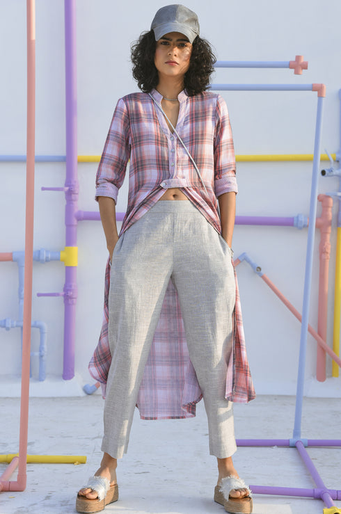 Model posing in straight-fit pants for women.